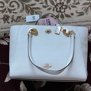 New with tags cream colored leather coach tote bag